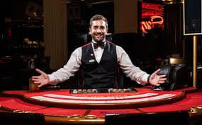 Teen Patti card table showing three-card hands and betting chips on 0.9 bet