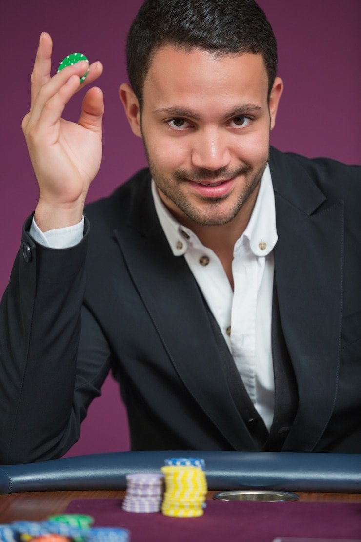 Live dealer casino table with professional host dealing cards in real-time broadcast